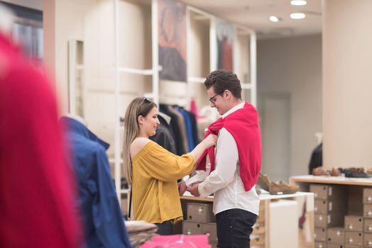 Attractive Couple Shopping In A Man's Clothing Store