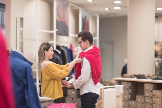 Attractive Couple Shopping In A Man's Clothing Store