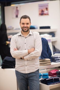 Portrait of an attractive man Shopping In A Man's Clothing Store