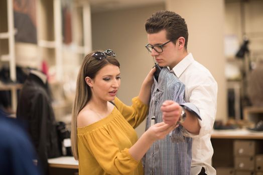 Attractive Couple Shopping In A Man's Clothing Store