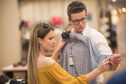 Attractive Couple Shopping In A Man's Clothing Store