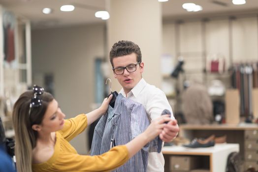 Attractive Couple Shopping In A Man's Clothing Store