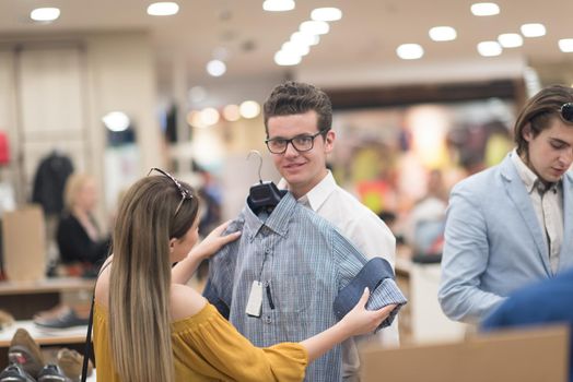 Attractive Couple Shopping In A Man's Clothing Store