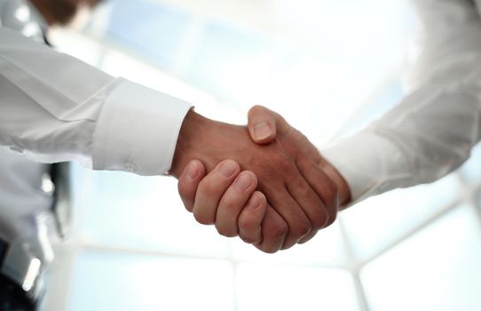 close up.reliable handshake of business partners .the concept of cooperation