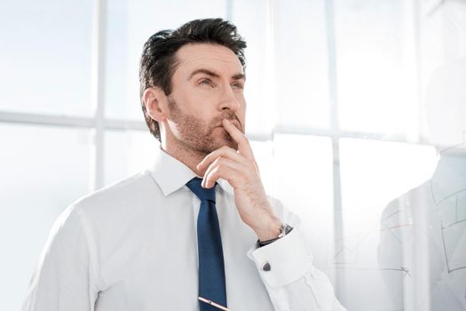 dreaming businessman standing in the office.business concept