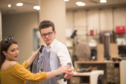 Attractive Couple Shopping In A Man's Clothing Store