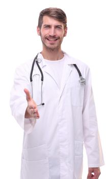 in full growth. doctor therapist holding out his hand for a handshake.isolated on white background