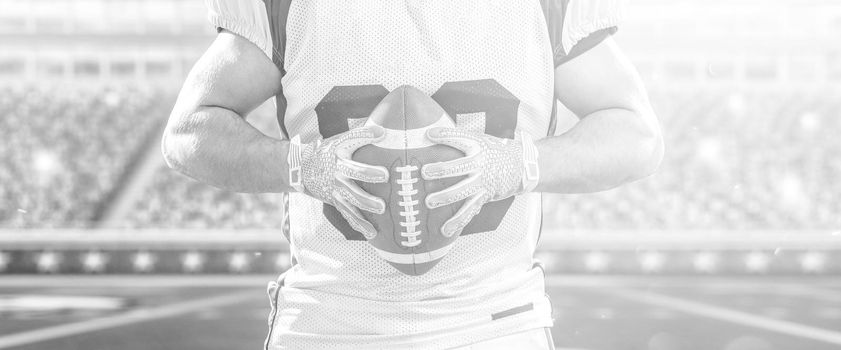 Closeup Portrait of a strong muscular American Football Player on big modern stadium field with lights and flares