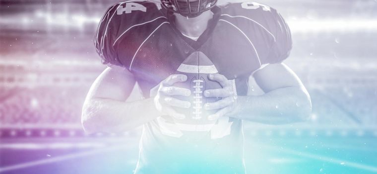 Closeup Portrait of a strong muscular American Football Player on big modern stadium field with lights and flares