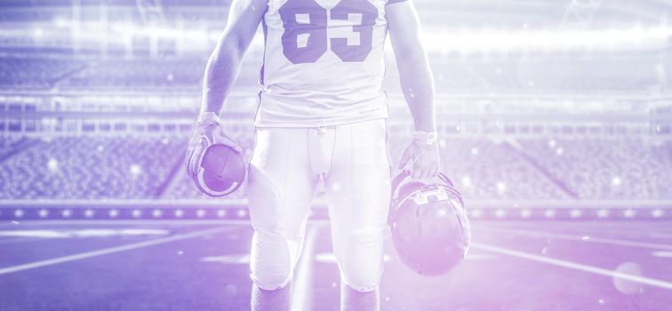 Closeup Portrait of a strong muscular American Football Player on big modern stadium field with lights and flares