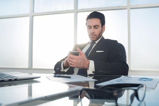 businessman using smartphone in the workplace.people and technology