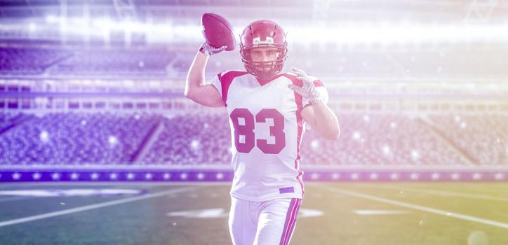 one quarterback american football player throwing ball on big modern stadium field with lights and flares