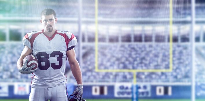 American Football Player isolated on big modern stadium field with lights and flares