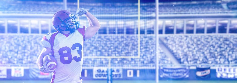 american football player celebrating touchdown on big modern stadium field with lights and flares