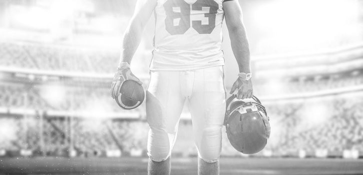 Closeup Portrait of a strong muscular American Football Player on big modern stadium field with lights and flares