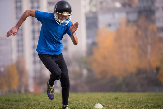 young american football player in action during the training at field