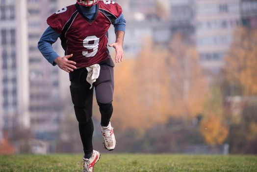 young american football player in action during the training at field