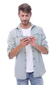 smiling man reading an SMS on the smartphone.isolated on white background