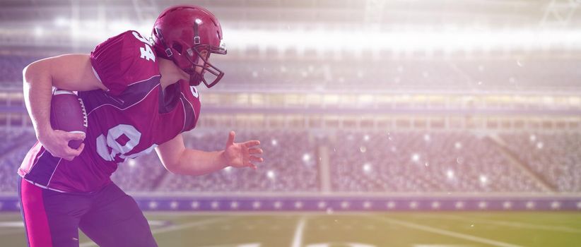 American football Player running with the ball isolated on big modern stadium field with lights and flares