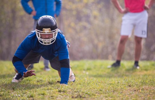 young american football player in action during the training at field