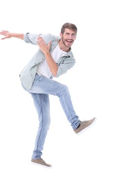 full-length. a happy modern man steps forward.isolated on white background