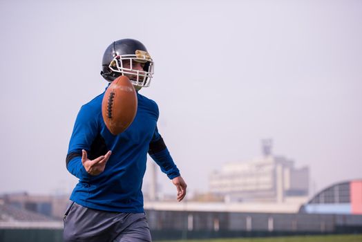 young american football player in action during the training at field