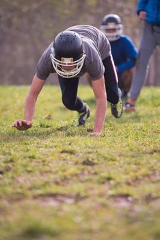 young american football player in action during the training at field