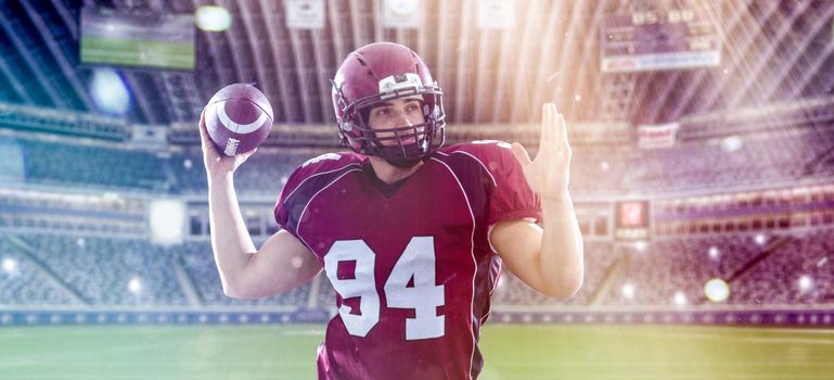 one quarterback american football player throwing ball on big modern stadium with lights and flares