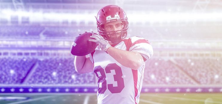 one quarterback american football player throwing ball on big modern stadium field with lights and flares