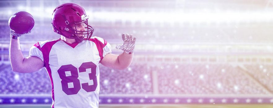 one quarterback american football player throwing ball on big modern stadium field with lights and flares