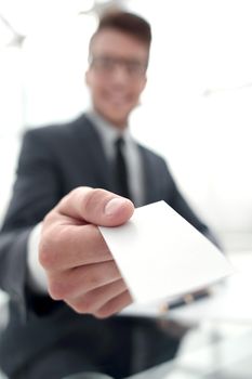 businessman handing you his business card .business concept