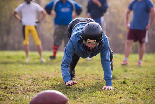 young american football player in action during the training at field