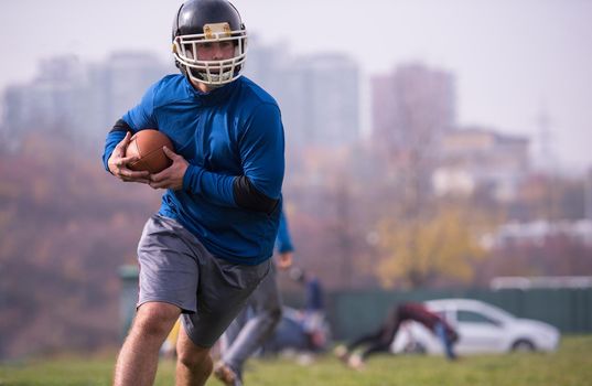 group of young american football players in action during the training at field