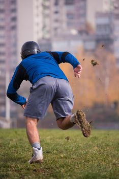 young american football player in action during the training at field