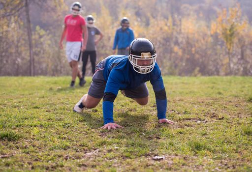 young american football player in action during the training at field