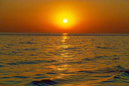 Warm, amazing sea wave close up on the beach sunrise like a sunset, nature landscape background.