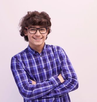 portrait  of smart looking arab teenager with glasses wearing a hat in casual school look isolated on white copy space