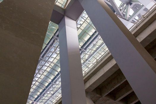 Powerful square columns going up and supporting the roof of the terminal.