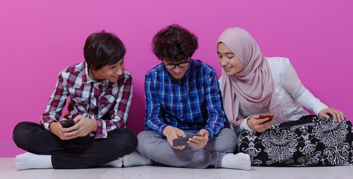 arab teenagers group using smart phones for social media networking and sharing of informations for online education