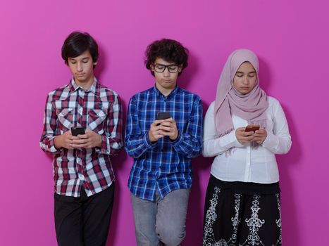 arab teenagers group using smart phones for social media networking and sharing of informations for online education