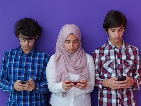 arab teenagers group using smart phones for social media networking and sharing of informations for online education