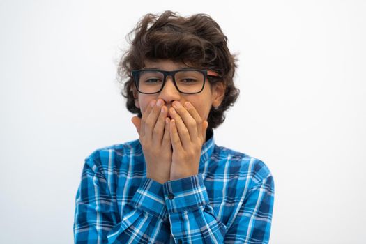 portrait of smart looking arab teenager with glasses wearing a hat in casual school look isolated on white copy space. High quality photo