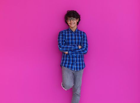 arab teenager with wearing  casual school look against pink background