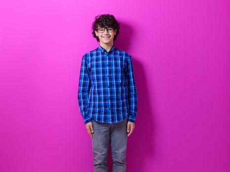 arab teenager with wearing  casual school look against pink background