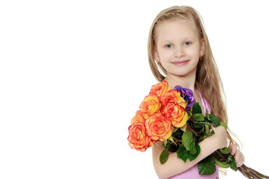 Happy little blond girl, with long curly hair, in a beautiful pink dress above the knees.With a large bouquet of tea roses.Isolated on white background.