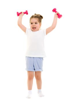 A cute little girl doing exercises with dumbbells. The concept of strength, health and sport. Isolated on white background.