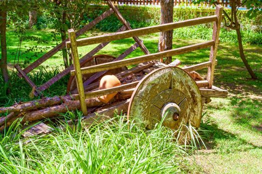An old, sprawling wooden cart with large wooden wheels. Turkey Kemer.