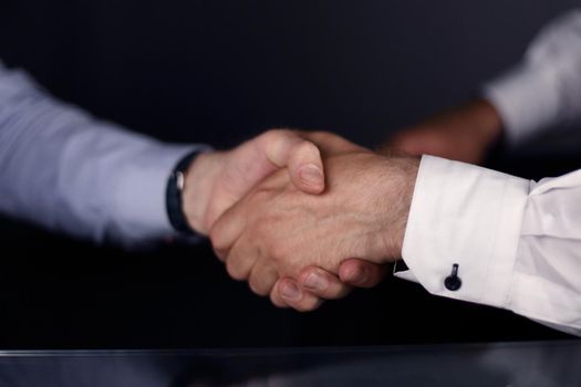 close up. a solid business handshake. business concept
