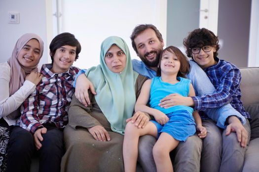 muslim family portrait with arab  teenage kids at modern home interior
