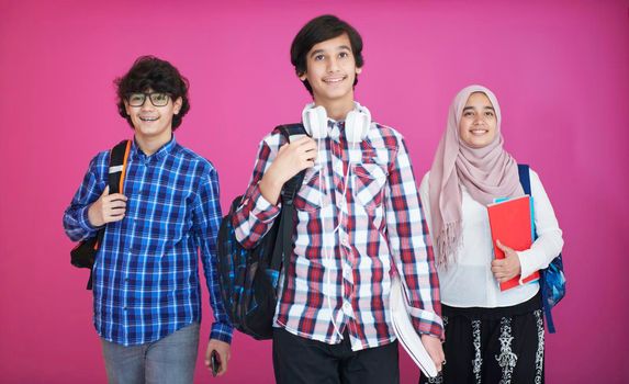 Arabic teenagers group, students team walking forward in future and back to school concept pink background